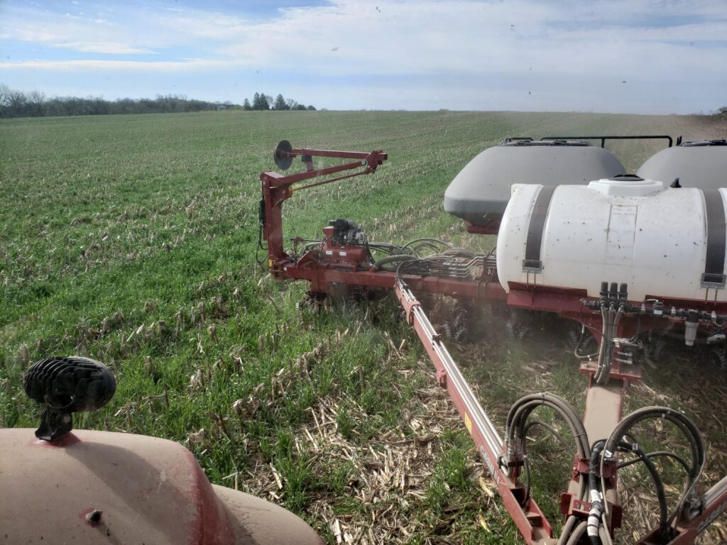 LASA member Jason Rowe planting soybeans into rye that was flown on into standing corn